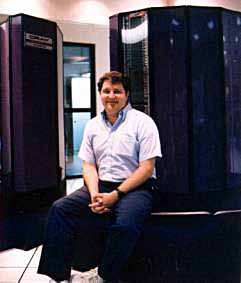 Dan Allen sitting on Apple's Cray XMP supercomputer