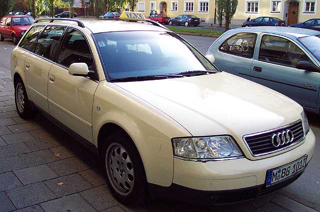 An Audi A4 taxi.  All taxies are diesels and are painted this light yellow color.
