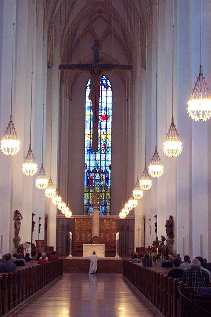 The inside of the Frauenkirche during a mass.