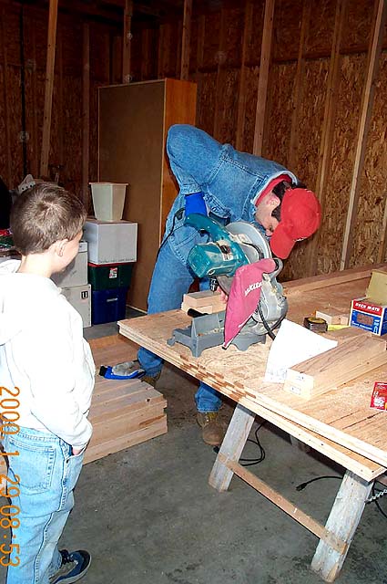 Tom using his cool power saw