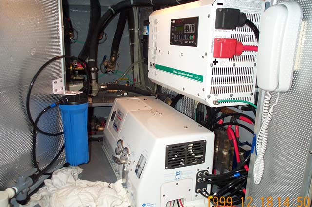 Reverse osmosis watermaker on the floor; pure sine wave inverter to the right, mounted on the wall